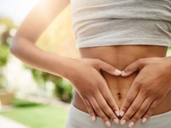 healthy woman with hand on her stomach